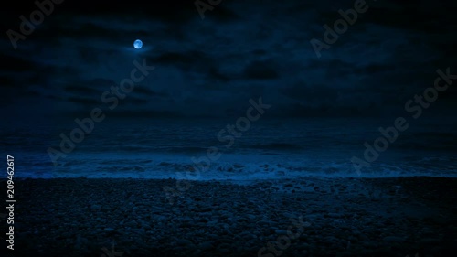 Rocky Beach With Waves Splashing At Night