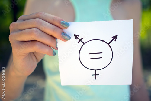 gender equality concept, a piece of paper with a transgender symbol in hand photo