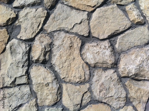 Decorative natural stone. Natural decoration of the facade of the house  building