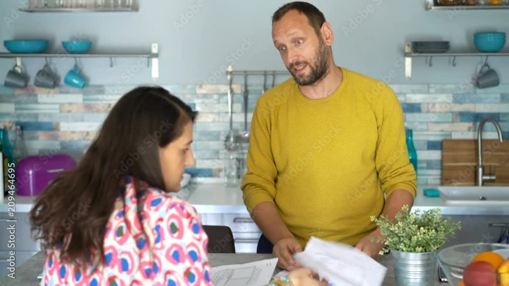 Young couple fighting, arguing over bills at home
Young couple fighting, arguing over bills at home