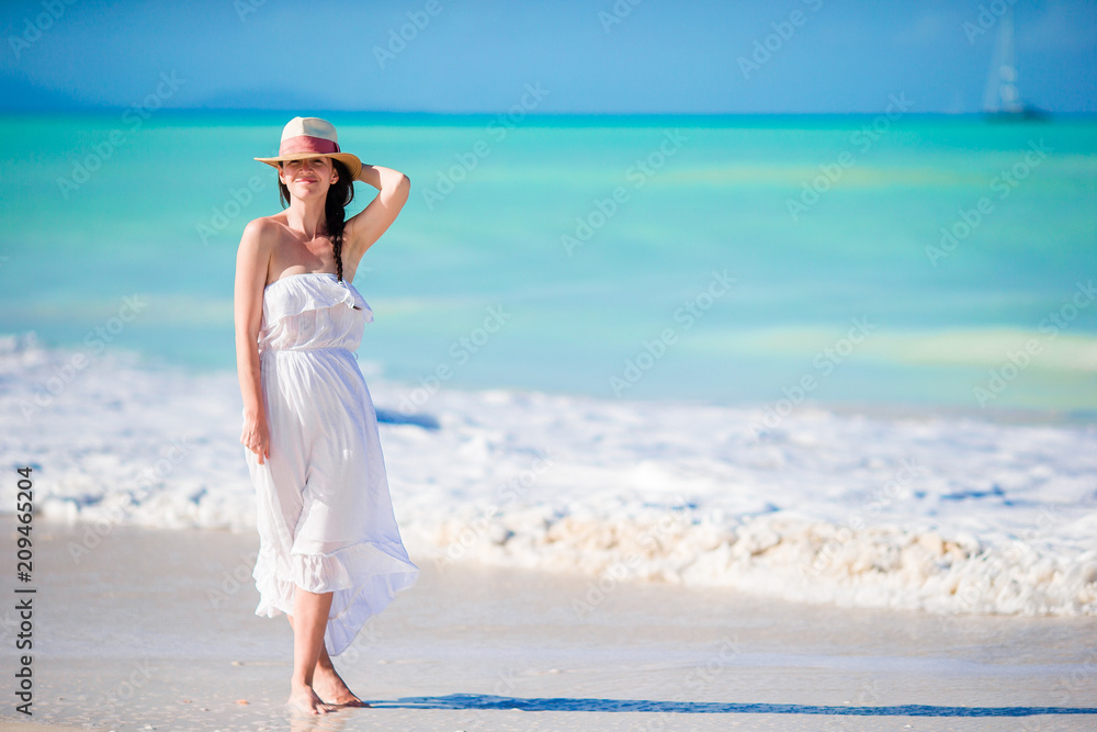 Caucasian girl with hat background the sea