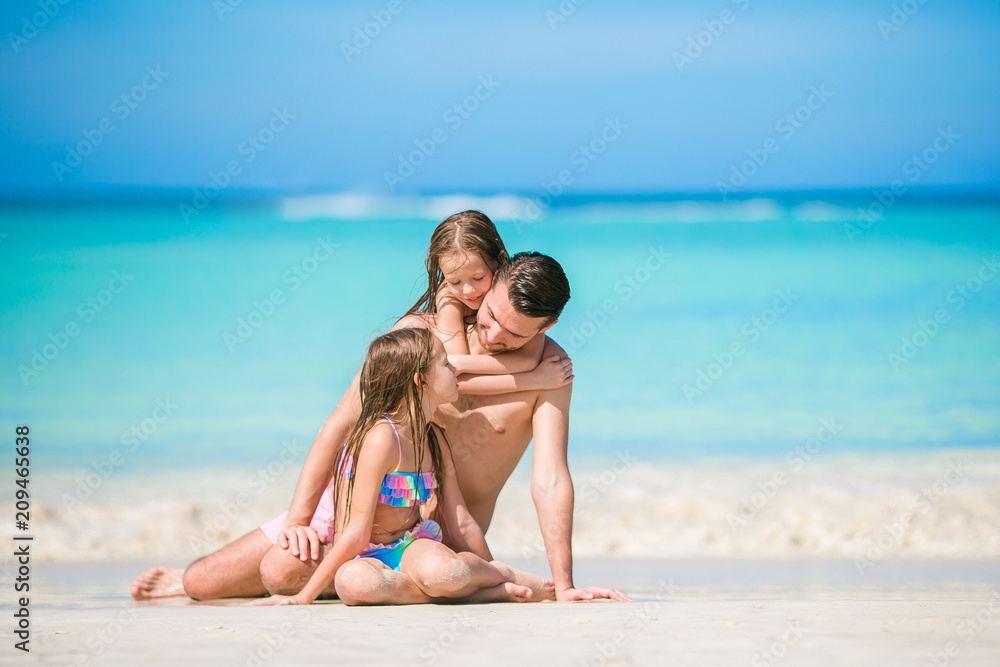 Father and kids enjoying beach summer vacation Father and kids enjoying beach summer vacation
