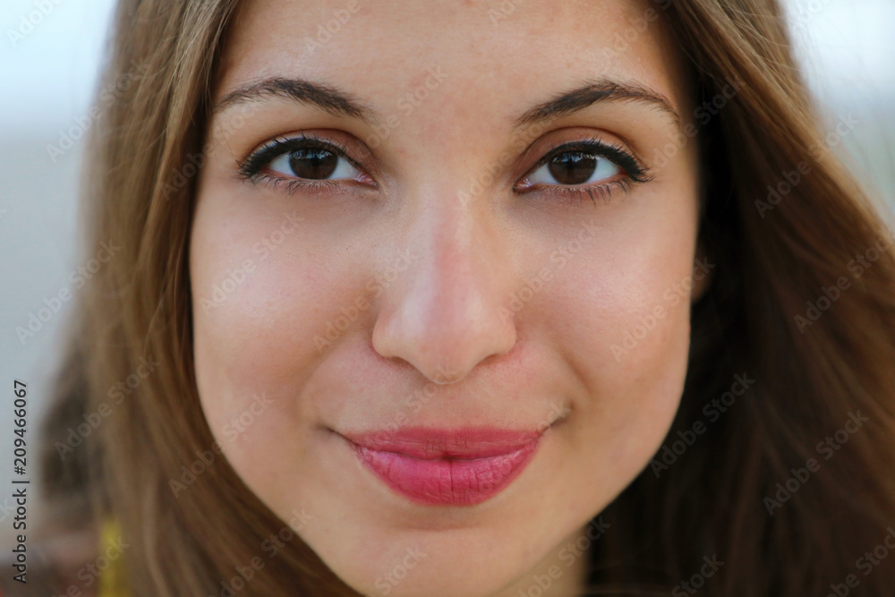 Close up of young model face smiling at camera. Very close up of mixed race model. Close up of young model face smiling at camera. Very close up of mixed race model.