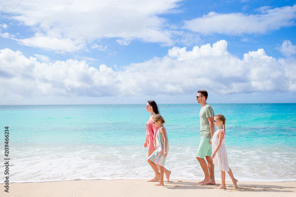 Happy beautiful family on the beach