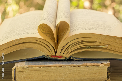 Old Book Opened on a Garden Table photo