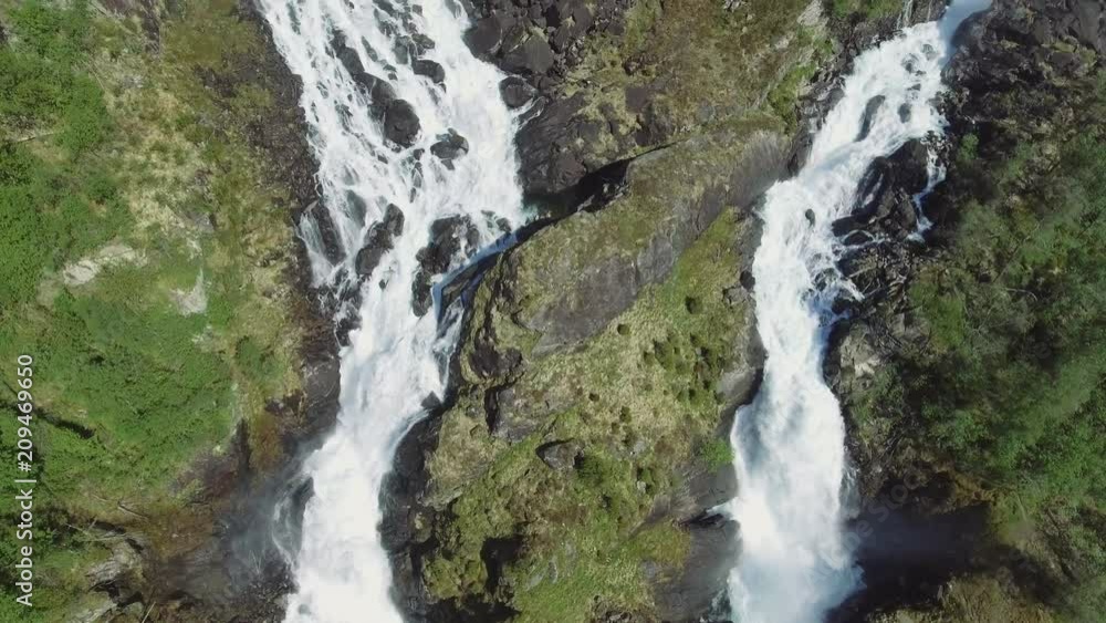 Latefossen - rapid waterfall in Norway. Aerial view, summer time.. Latefoss is a powerful, twin waterfall, famous sightseeing Latefossen - rapid waterfall in Norway. Aerial view, summer time.. Latefoss is a powerful, twin waterfall, famous sightseeing