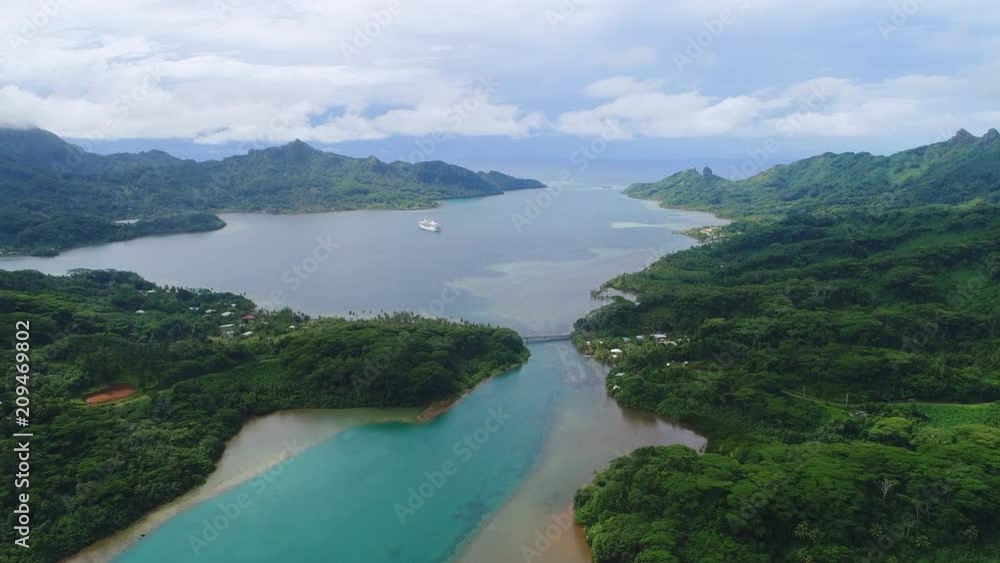 Aerial panoramic view of tropical paradise of Huahine island, Maroe Bay, slopes of hills covered in lush green rain forest - South Pacific Ocean, panorama landscape of French Polynesia from above Aerial panoramic view of tropical paradise of Huahine island, Maroe Bay, slopes of hills covered in lush green rain forest - South Pacific Ocean, panorama landscape of French Polynesia from above