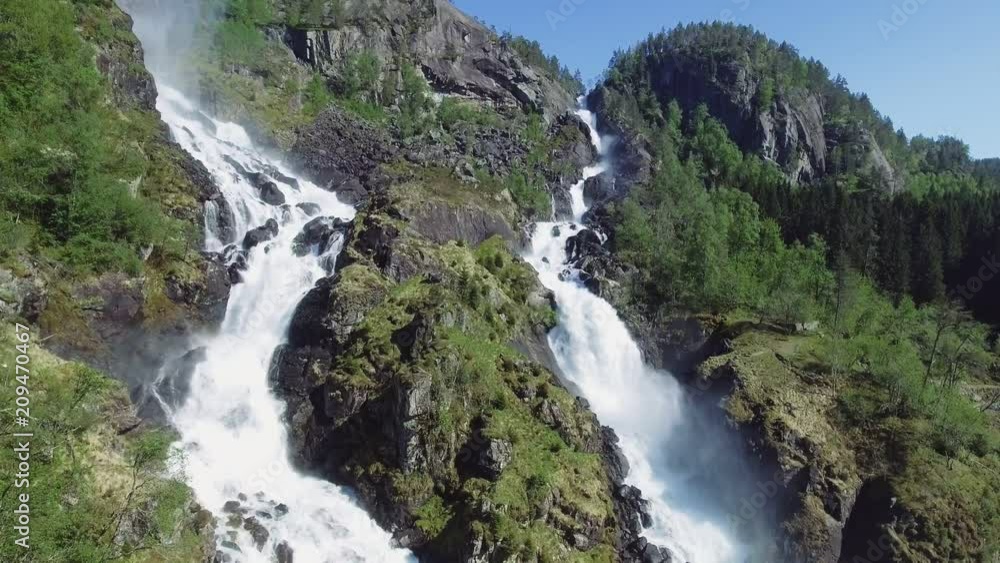 Latefossen - rapid waterfall in Norway. Aerial view, summer time.. Latefoss is a powerful, twin waterfall, famous sightseeing Latefossen - rapid waterfall in Norway. Aerial view, summer time.. Latefoss is a powerful, twin waterfall, famous sightseeing
