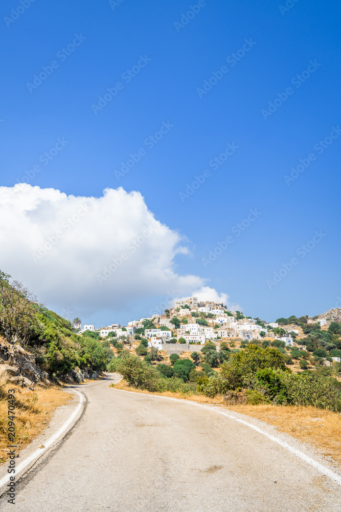 Nisyros Island, Emporios, Kos - Greece: Fantastic beautiful peaceful view of a small Greek mountain village with white houses and red roofs which has been spared from tourism at the edge of a volcano