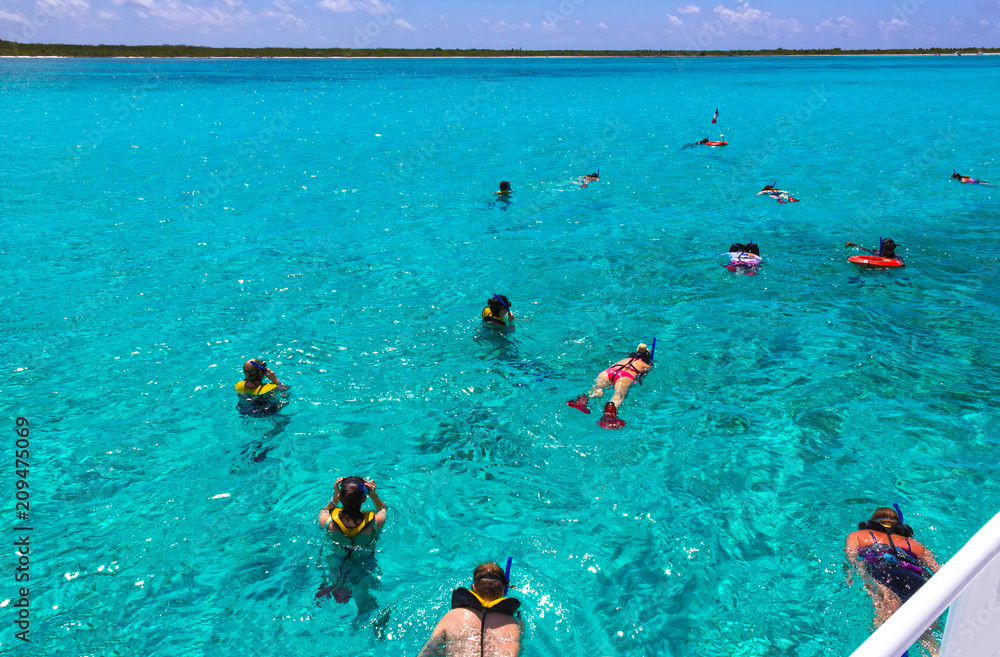 Cozumel, Mexico - Group of friends relaxing together on a party boat tour of the Carribean Sea