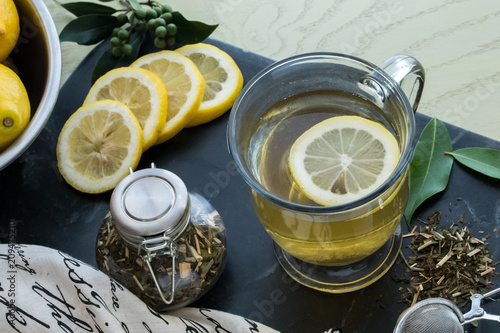 Green Tea-loose leaf_with sliced lemons-healthy hot beverage photo