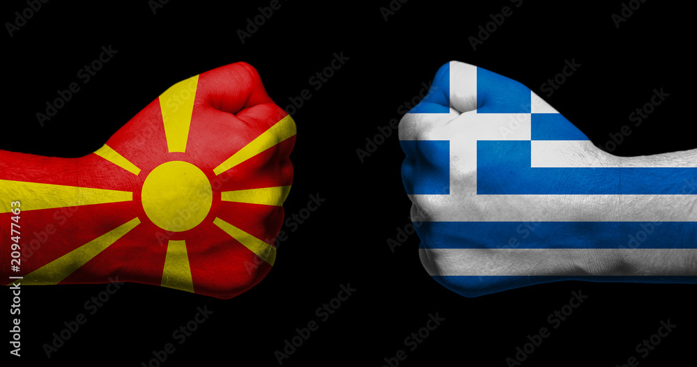 Flag of the Republic of Macedonia and Greece painted on two clenched