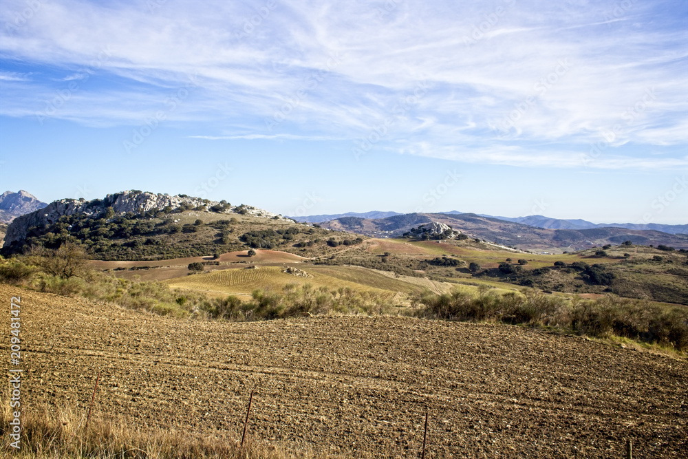 A view across farmland in the Sierra de las Cabras, Malaga, Andalucia, Spain.