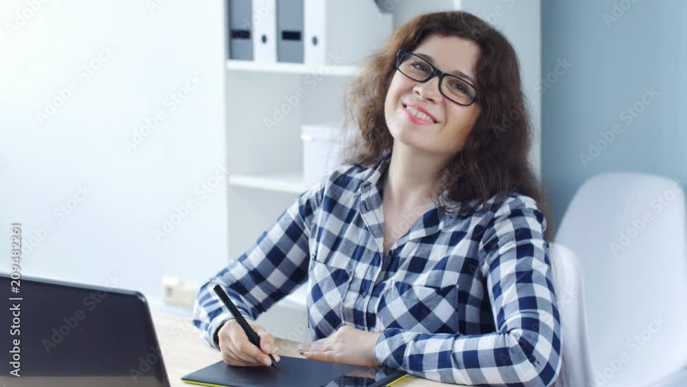 Young woman Graphic designer using graphics tablet Young woman Graphic designer using graphics tablet
