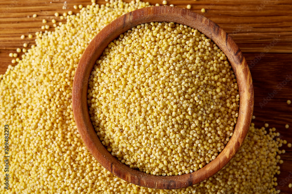 Lentils in a wooden bowl on rustic wooden background, top view, close-up, selective focus. Lentils in a wooden bowl on rustic wooden background, top view, close-up, selective focus.