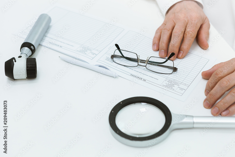 Dermatoscope lying on the table Dermatoscope lying on the table