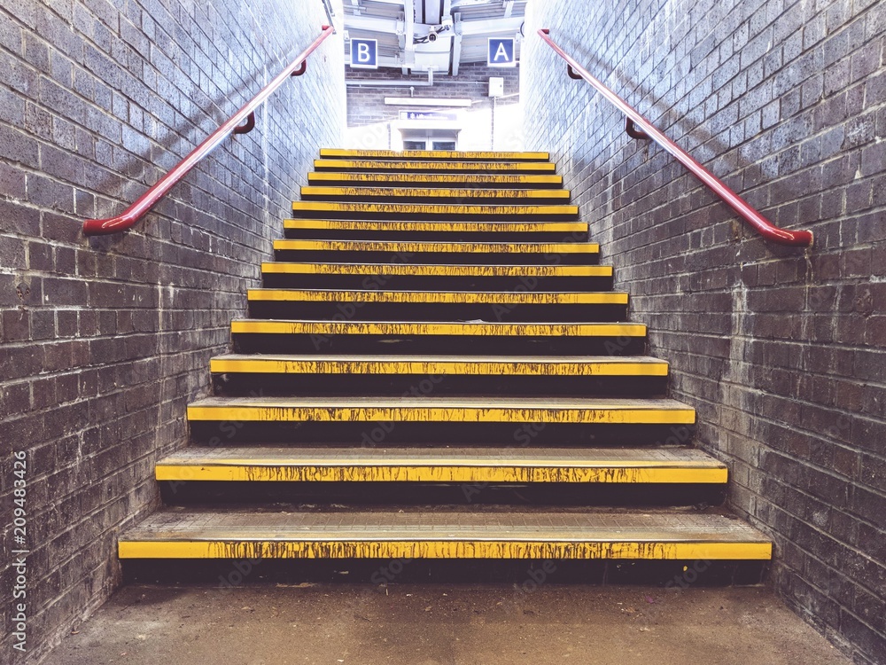 Yellow steps at train station Yellow steps at train station