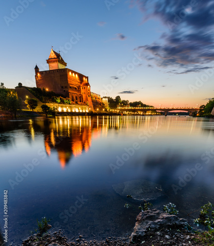 Beautiful night view of Narva Castle with tall Herman's tower, Narva, Estonia