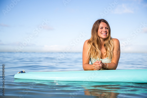 Athlete chilling on her paddle board in Hawaii