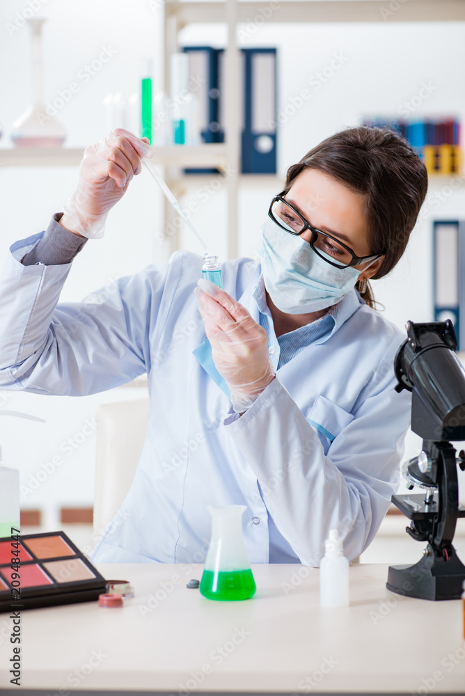 Lab chemist checking beauty and make-up products Lab chemist checking beauty and make-up products