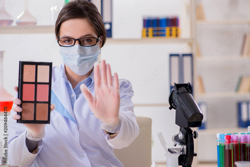 Lab chemist checking beauty and make-up products Lab chemist checking beauty and make-up products