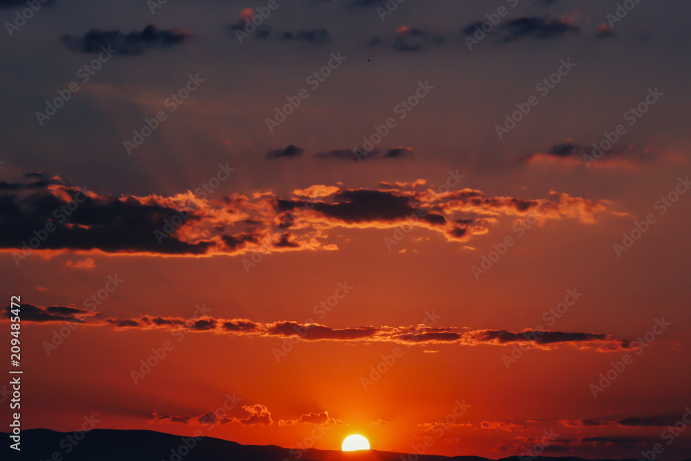 Naklejka premium Sunset over Ankara Turkey skies. beautiful landscape with a red sunset sky over the field