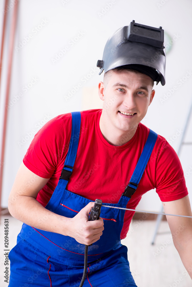 Contractor working in the workshop Contractor working in the workshop