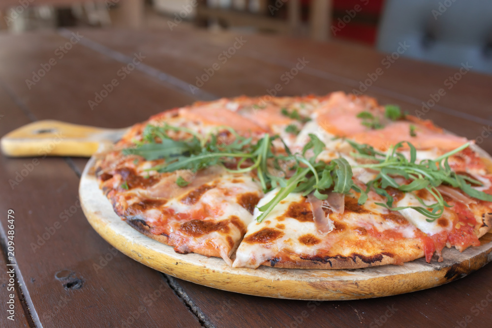 Delicious Baked Italian Salmon Pizza on The Wooden Table Delicious Baked Italian Salmon Pizza on The Wooden Table