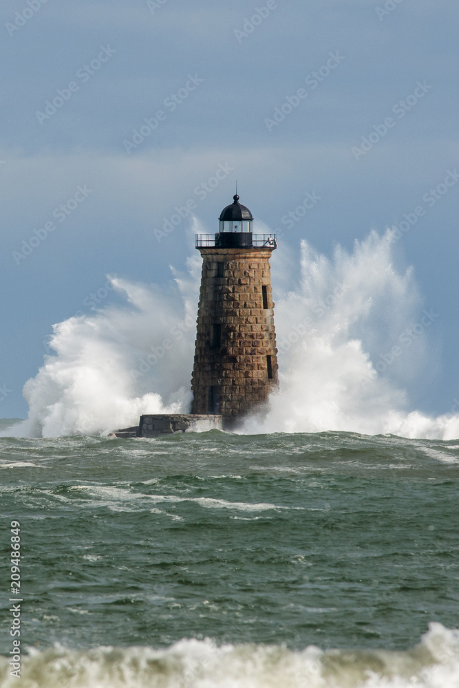 Huge Waves Surround Stone Lighthouse Tower in Maine