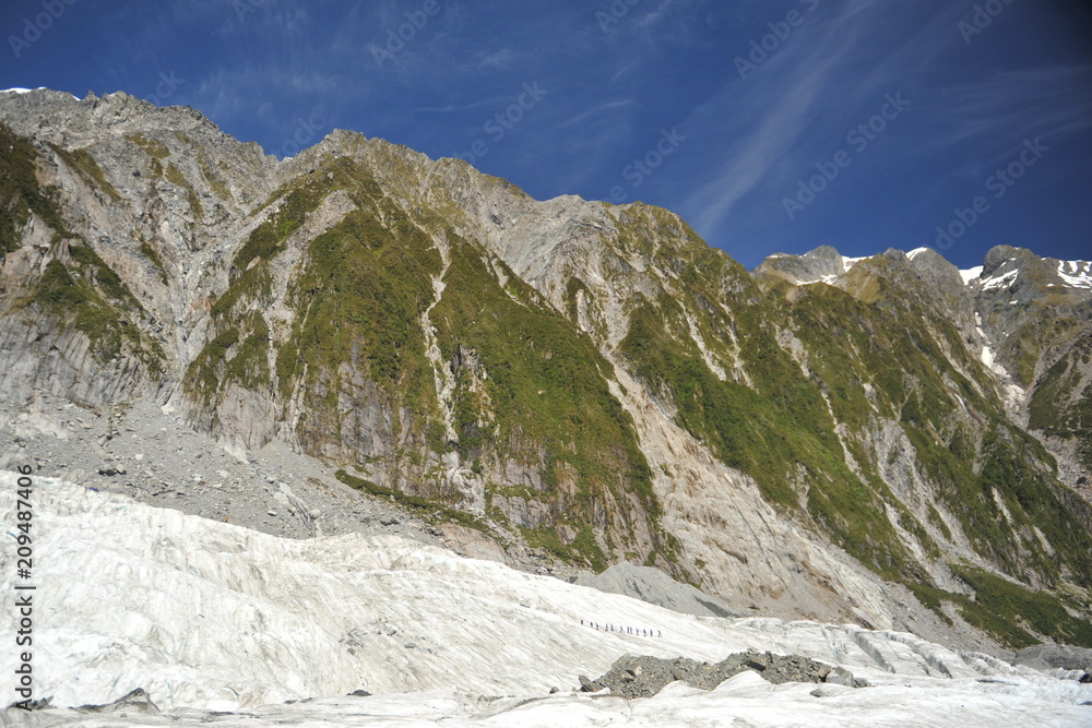 New Zealand. A group of climbers walking along the glacier
