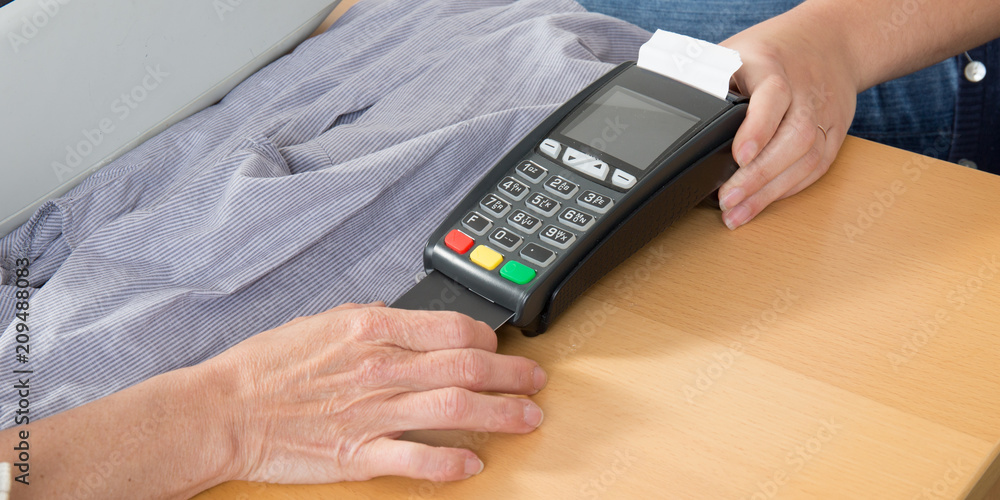Card payment Hand of Woman Using Payment Terminal in an Shop, Paying With Credit Card Reader in Finance Concept Card payment Hand of Woman Using Payment Terminal in an Shop, Paying With Credit Card Reader in Finance Concept