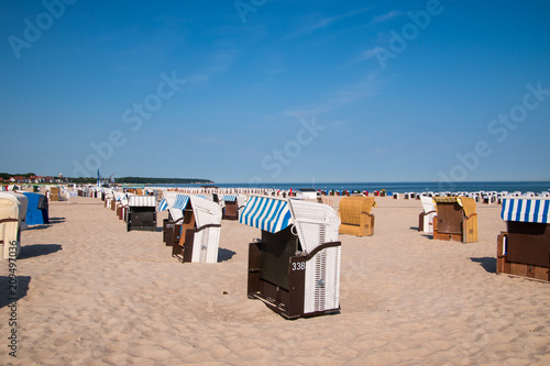 Closed beach chair huts on white sand beach in Warnemunde Germany © ALAN