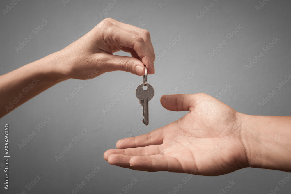 Handing key from one hand to another
