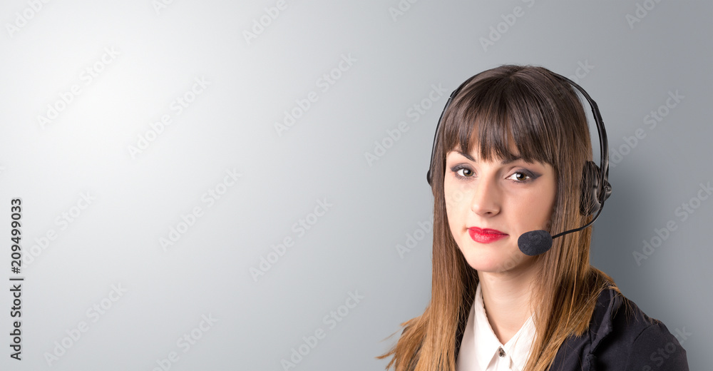 Young female telemarketer on a white background Young female telemarketer on a white background