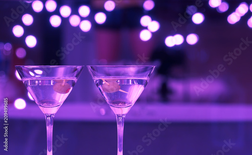 Pair of cocktail drinks on bar. 
