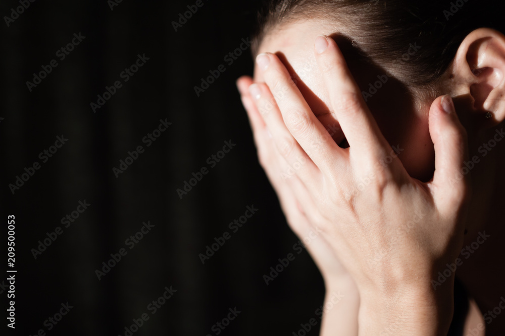 Isolated sad woman with hand over face. Isolated sad woman with hand over face.