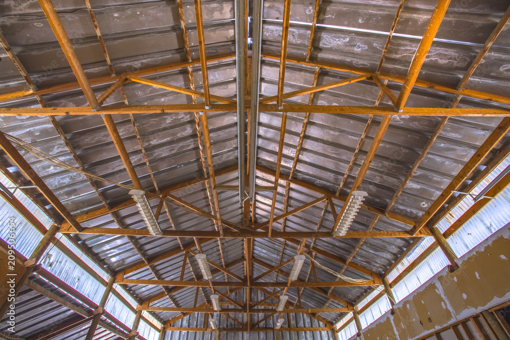 Interior view of the roof of an old barn with wood