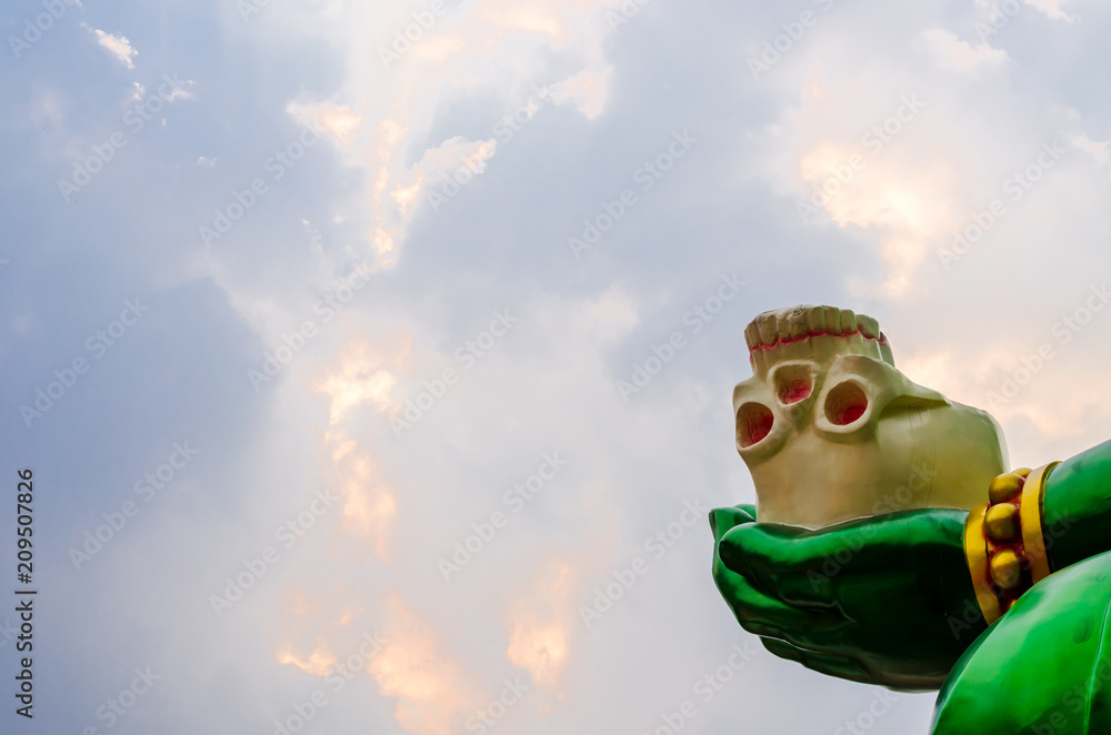 Skull on the hand of ganesh lord in Hindu temple