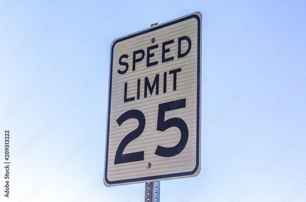 Speed limit sign viewed with a sky background Speed limit sign viewed with a sky background