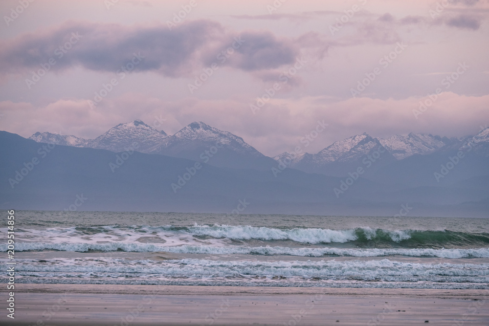 Beautiful scene of the beach with snow mountain at dusk. Beautiful scene of the beach with snow mountain at dusk.