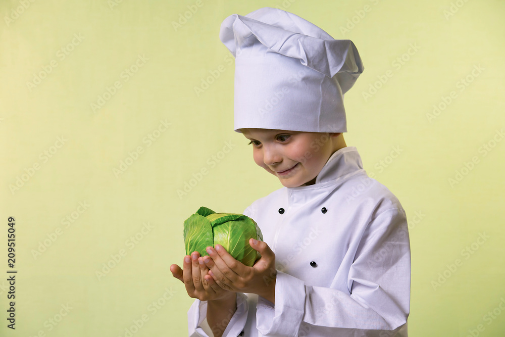 funny boy chef keeps in hands green cabbage funny boy chef keeps in hands green cabbage