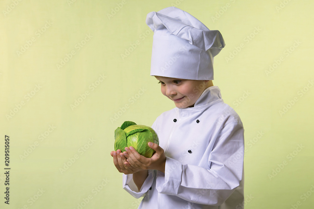 funny boy chef keeps in hands green cabbage funny boy chef keeps in hands green cabbage