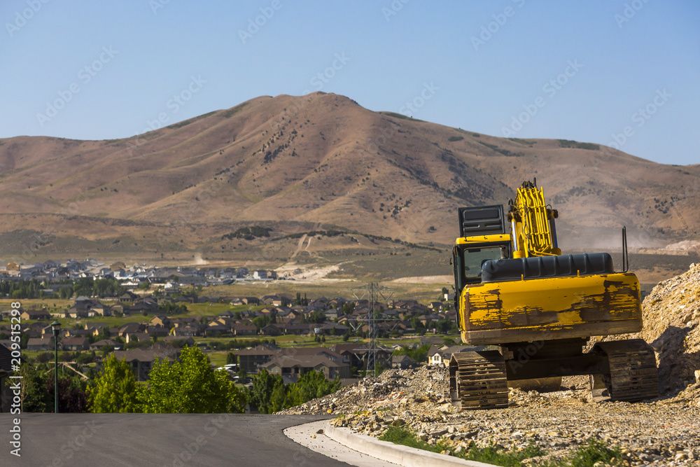 Tractor sitting on next to new construction Tractor sitting on next to new construction