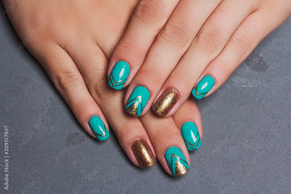 Summer nail art in turquoise and gold color Summer nail art in turquoise and gold color
