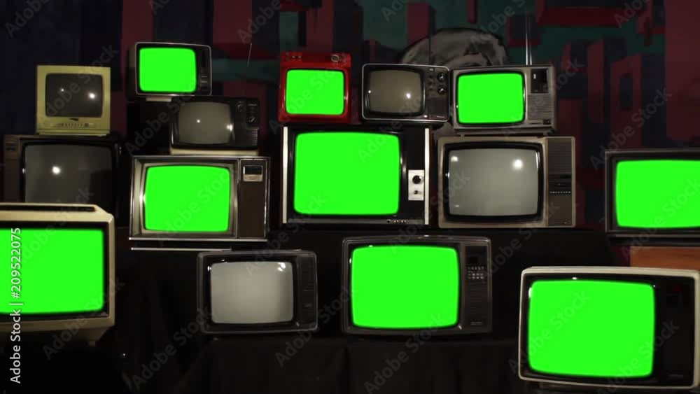 Many Tvs with Green Screens. Zoom Out. Aesthetics of the 80s. You can replace green screen with