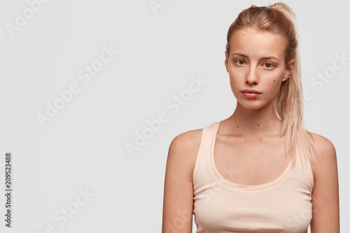 Tender and cute female has European appearance, pony tail, dressed in casual ...