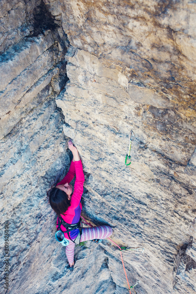 Fototapeta premium The woman is on a rock.
