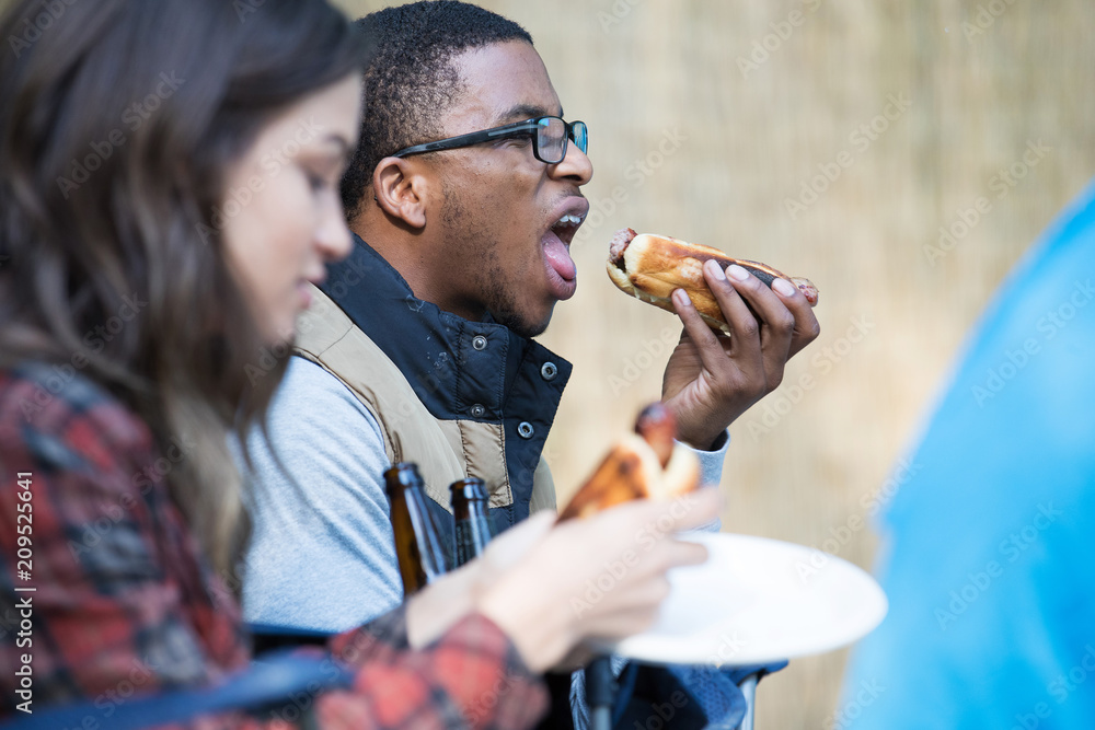Man with open mouth eating large hot dog Stock Photo Adobe Stock