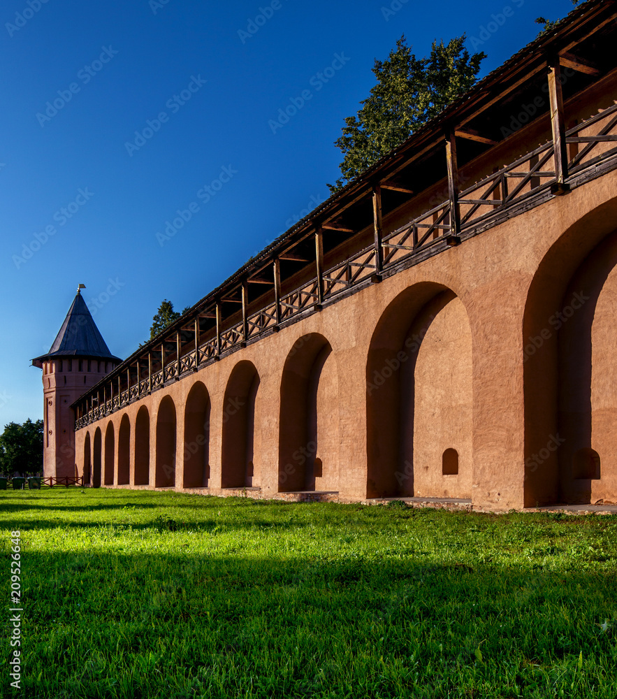 Suzdal. Pokrovsky Monastery. Monastery wall from a red brick. Very beautiful prospect