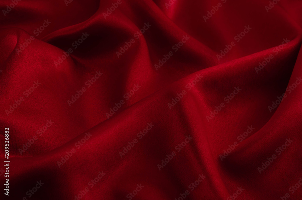 Fototapeta premium Abstract silk luxury background, piece of cloth, deep red cloth texture